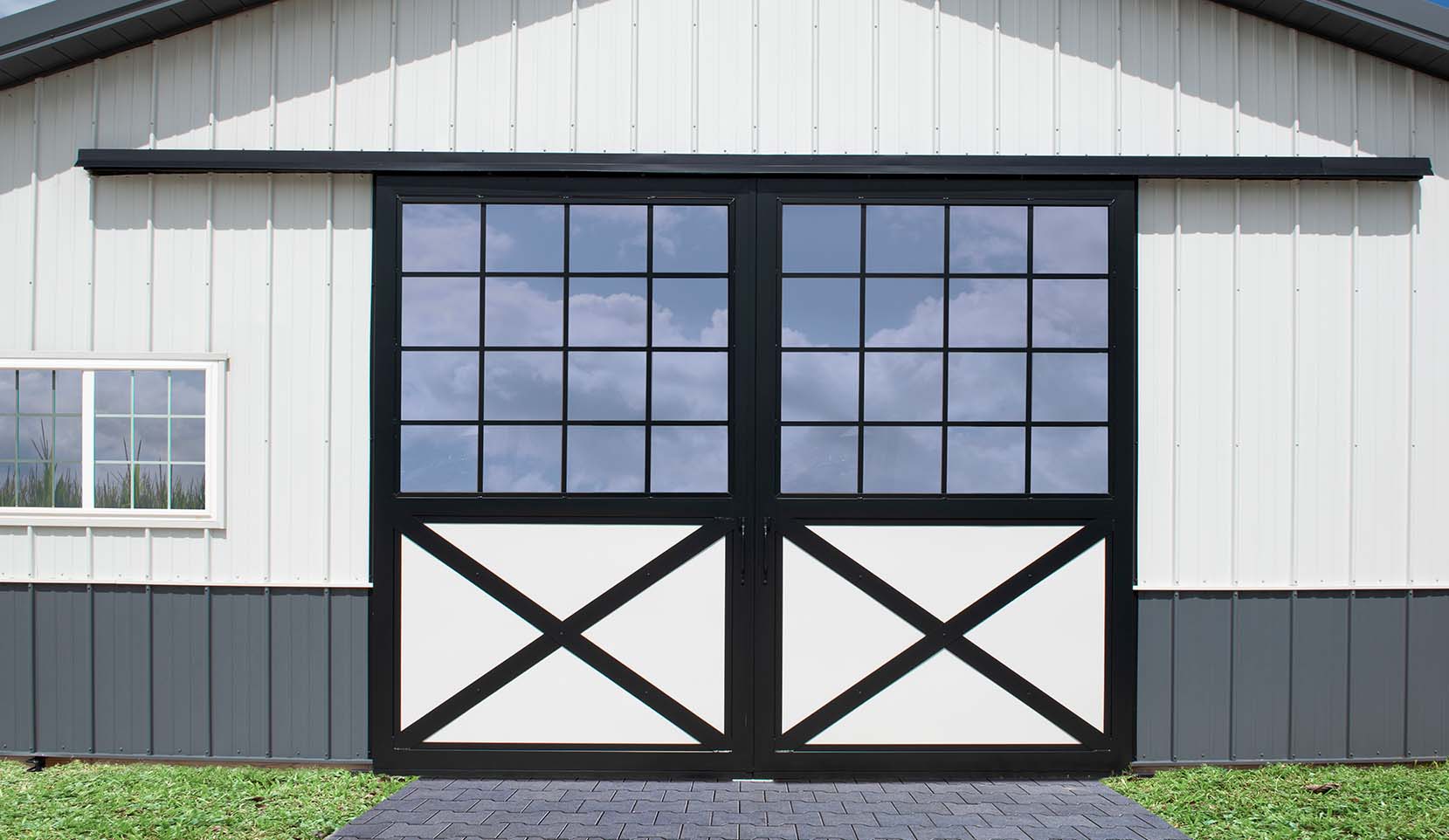 Barn end door with UV- and scratch-resistant, high-impact,Polycarbonate window fill.
