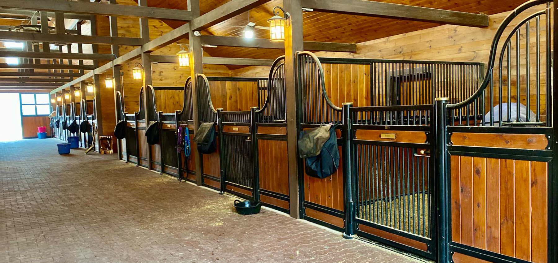 European Series low-curved hinged-door stall fronts w/HVH and grill bottom door