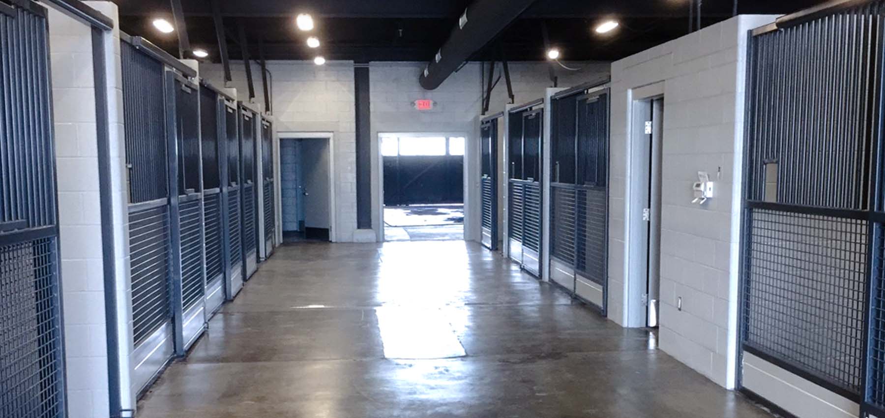 Low Kimberwick Series hinged-door stall front component kits with wood-fill