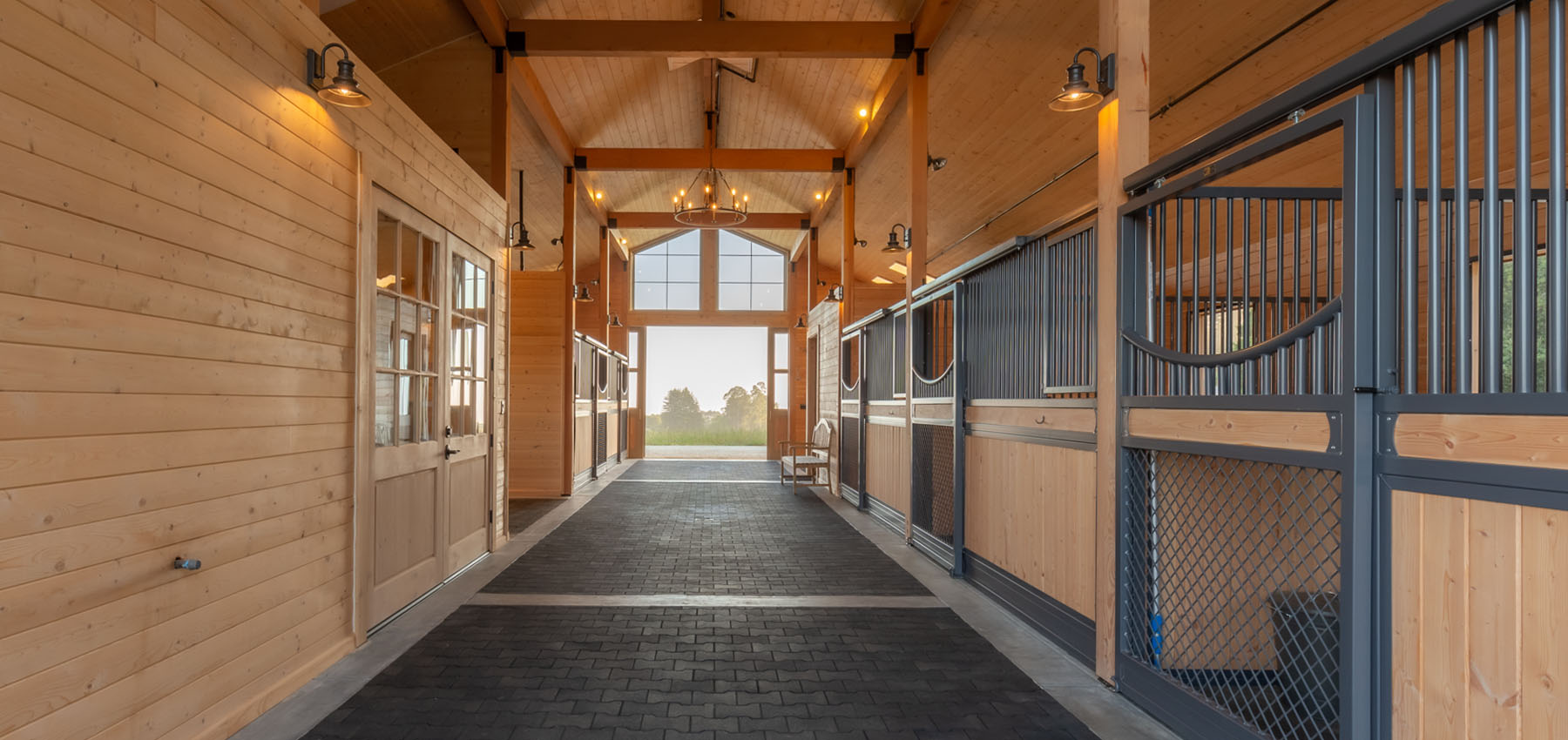 Private barn interior. Custom mesh gates and Legend sliding doors.