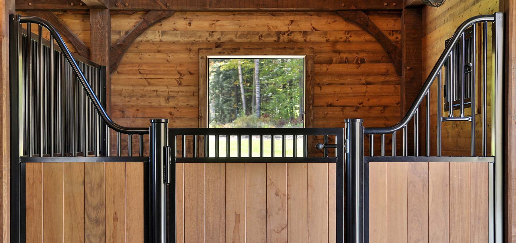 Low European Series hinged-door stall fronts with plunger latch