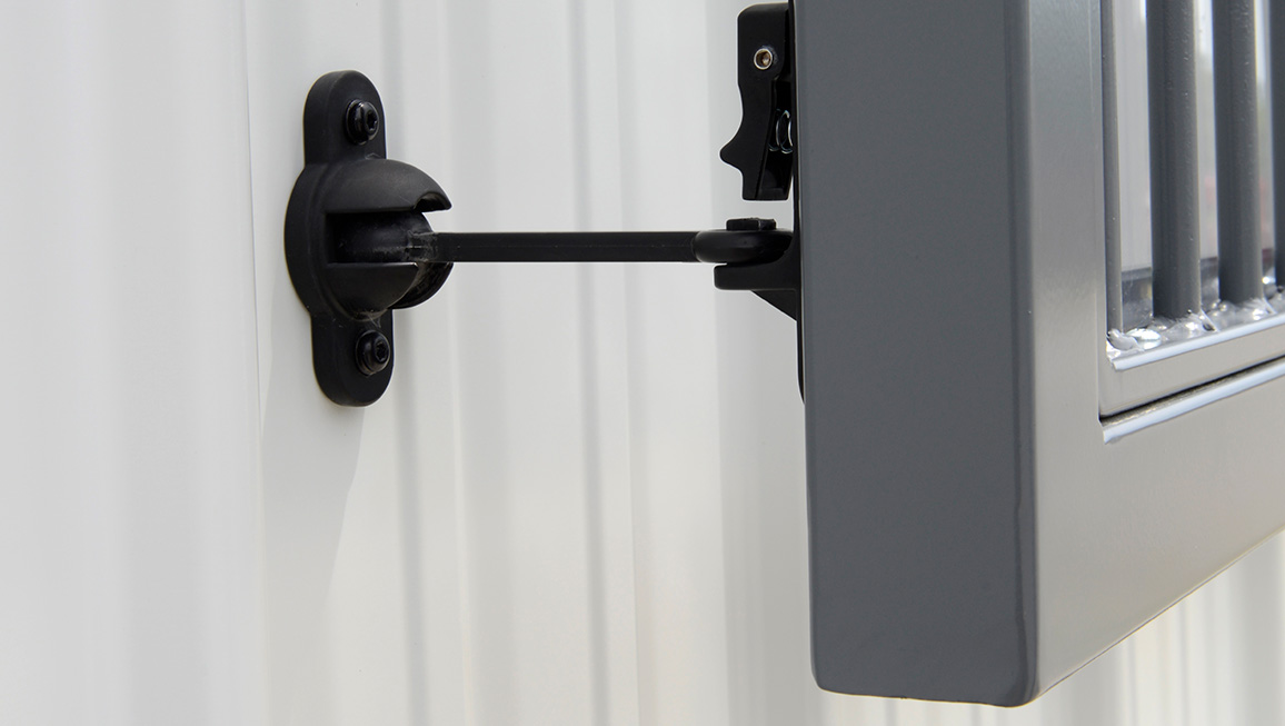 Hinged barn window exterior safety latch