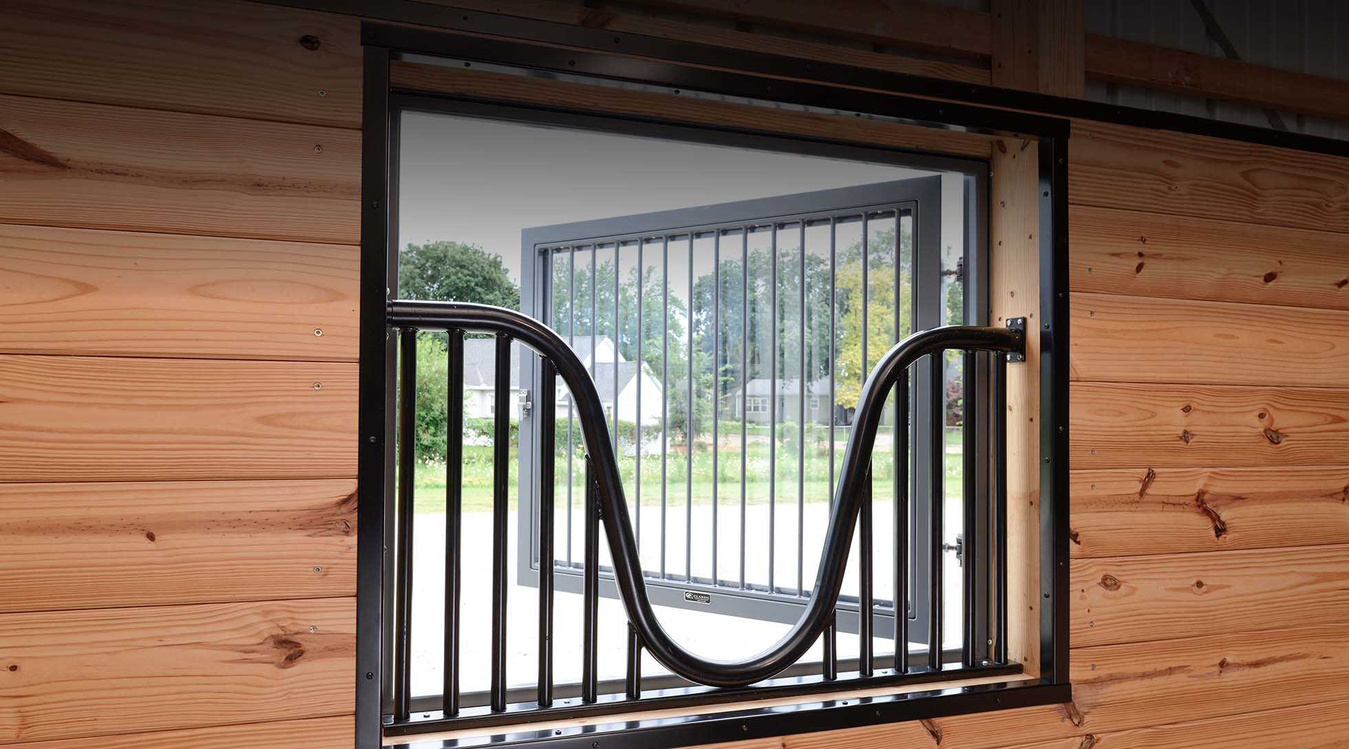 Hinged barn window with yoke and chew guard