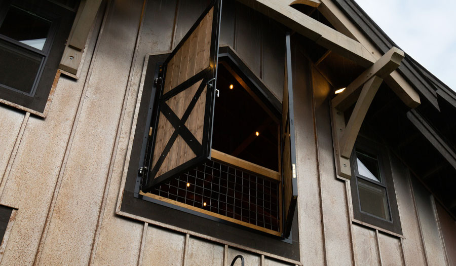 Style LD001 - Hinged custom angle-top loft doors with crossbucks
