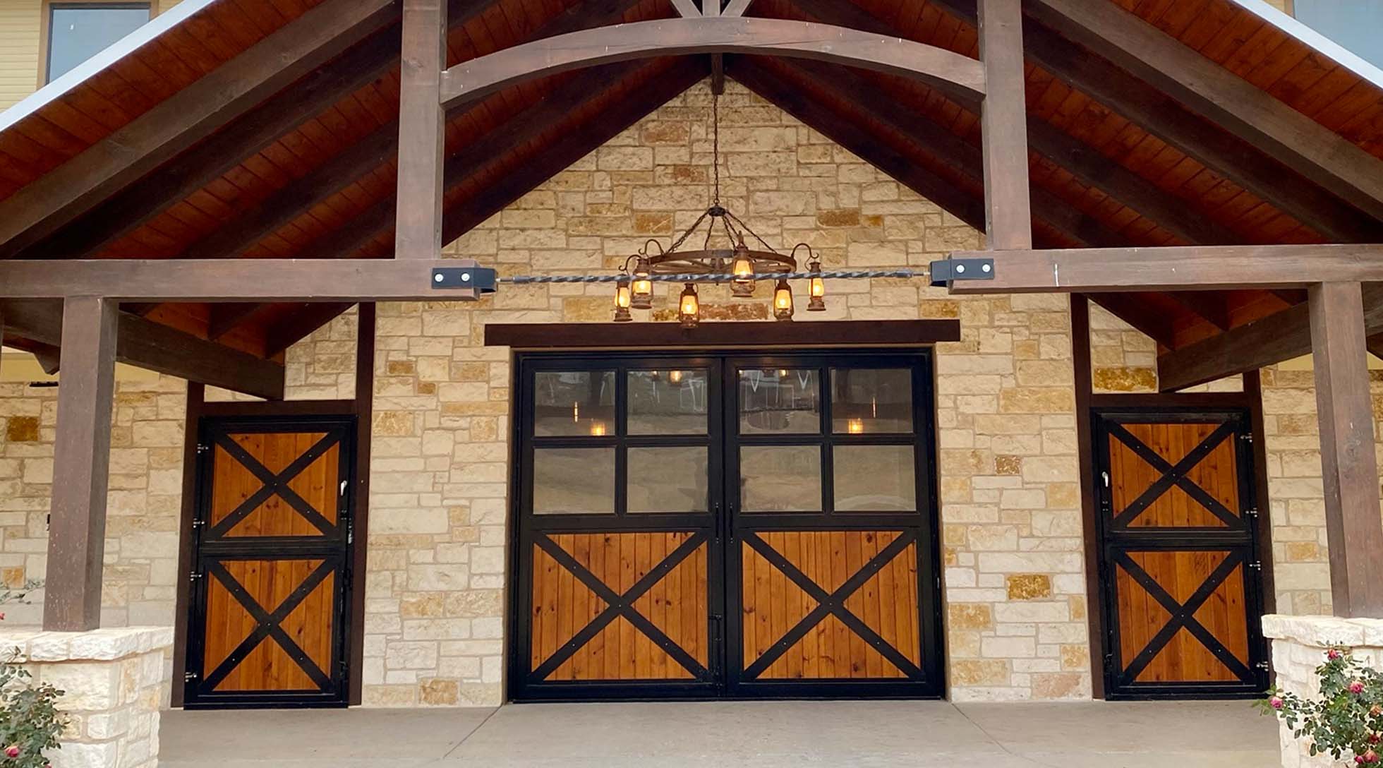 Framed glass barn end door with cross-buck