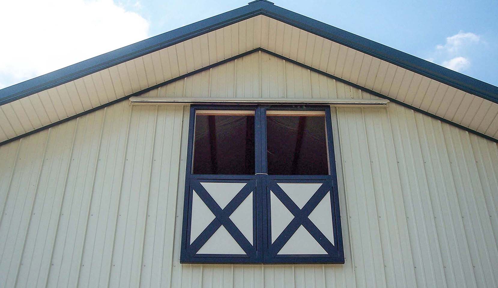 Split siding loft doors with crossbuck