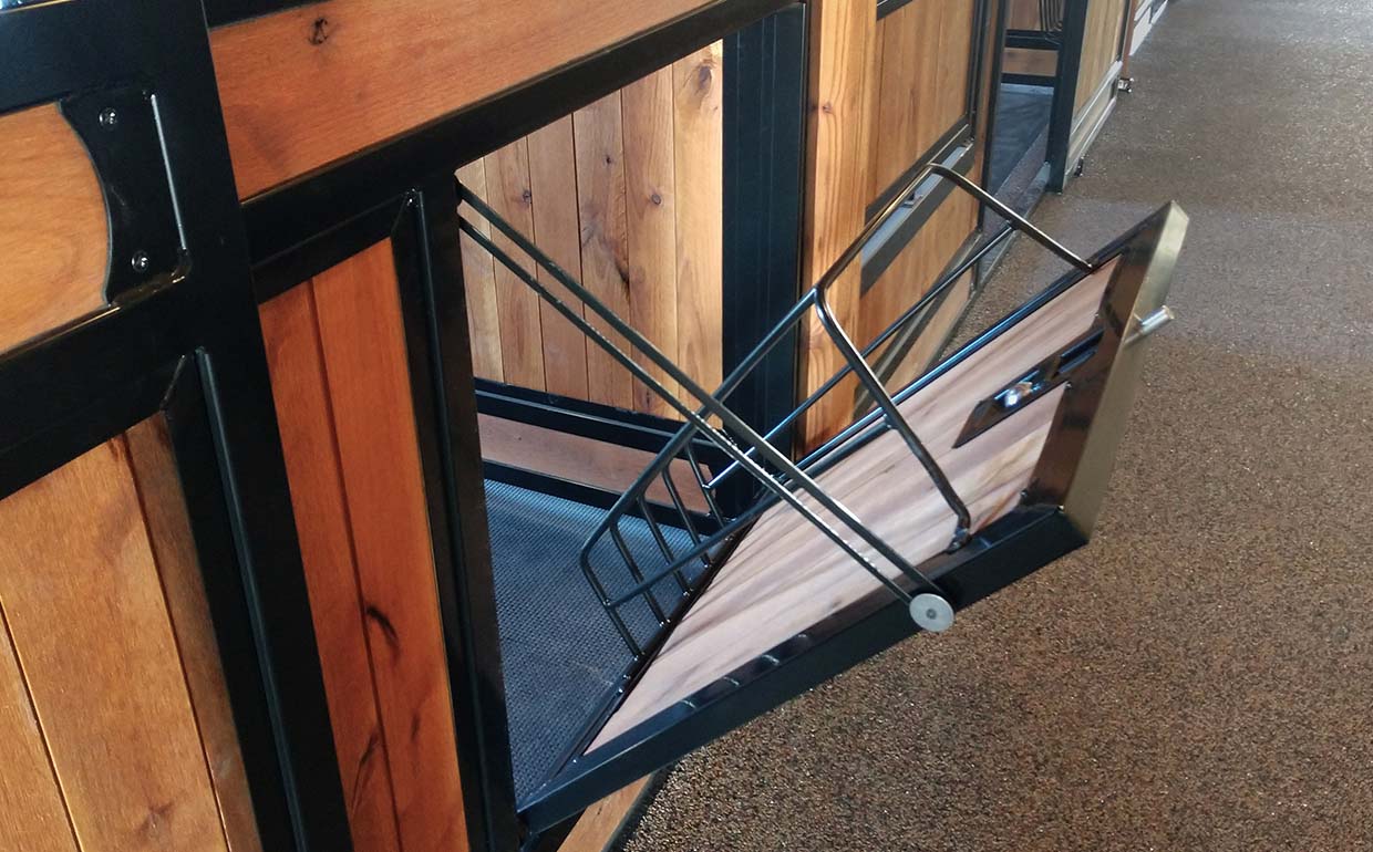 Tilt out hay feeder
