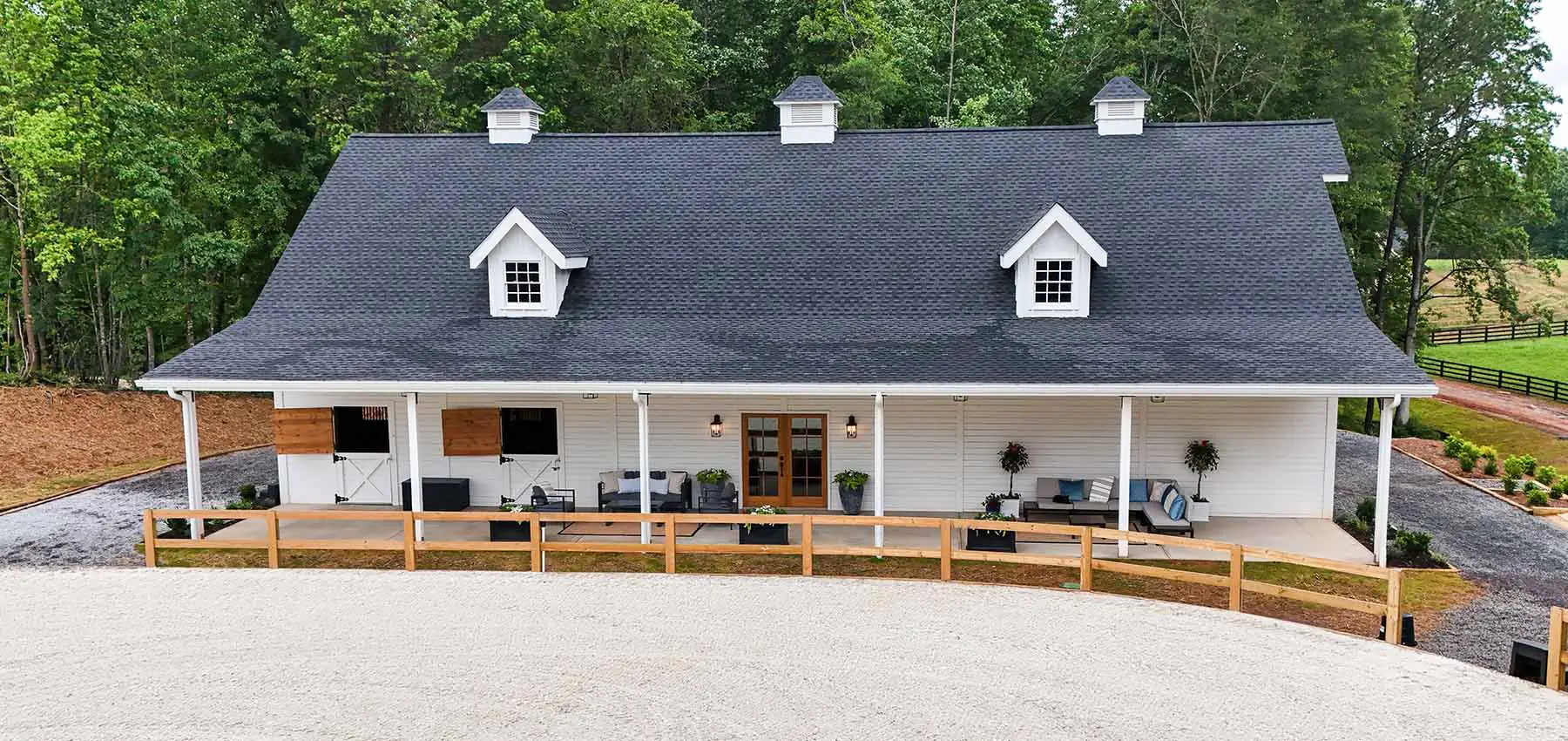 Exterior view of private barn and riding arena.