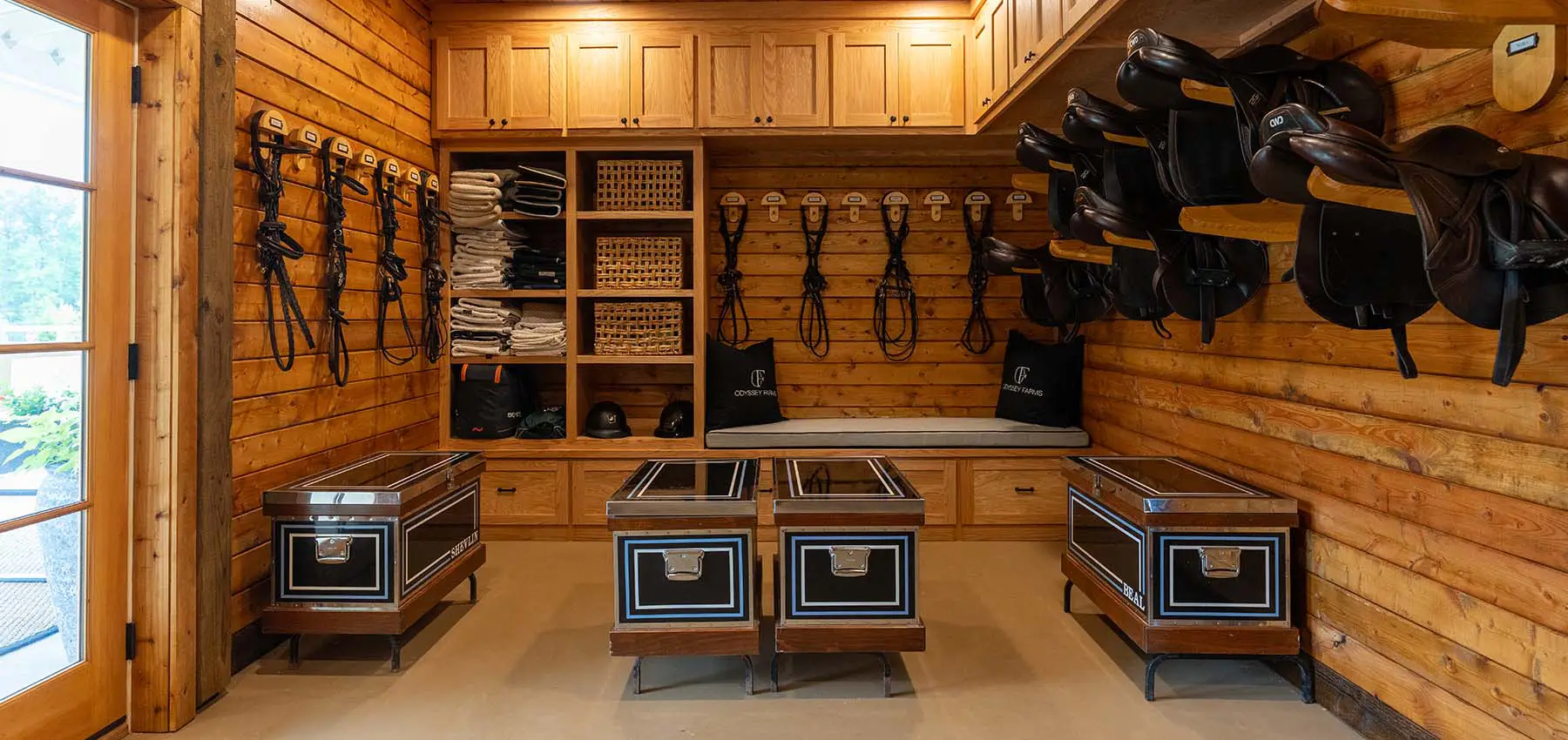 Tack room with saddles and tack trunks