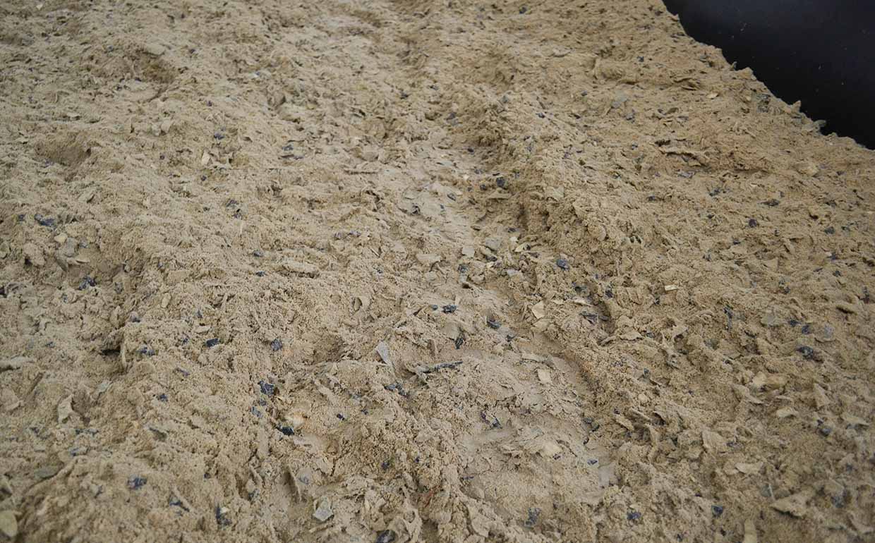 Close up of FootingFirst™ dust-free arena footing