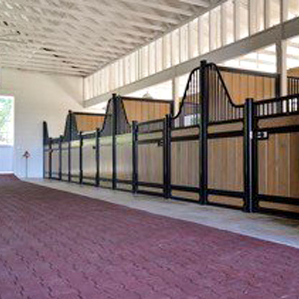 Low European stall fronts with hinged stall doors. True-step® pavers in terracotta red