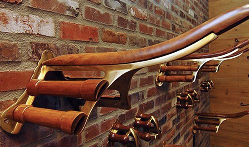 Saddle and bridle holders mounted to brick tack wall